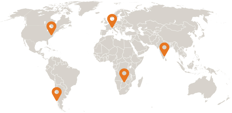 A world map with orange locator pins