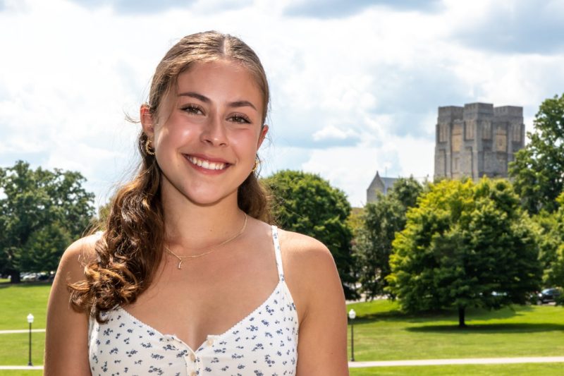 Yasemin Tanyu with the Drillfield and Burruss Hall in the background.