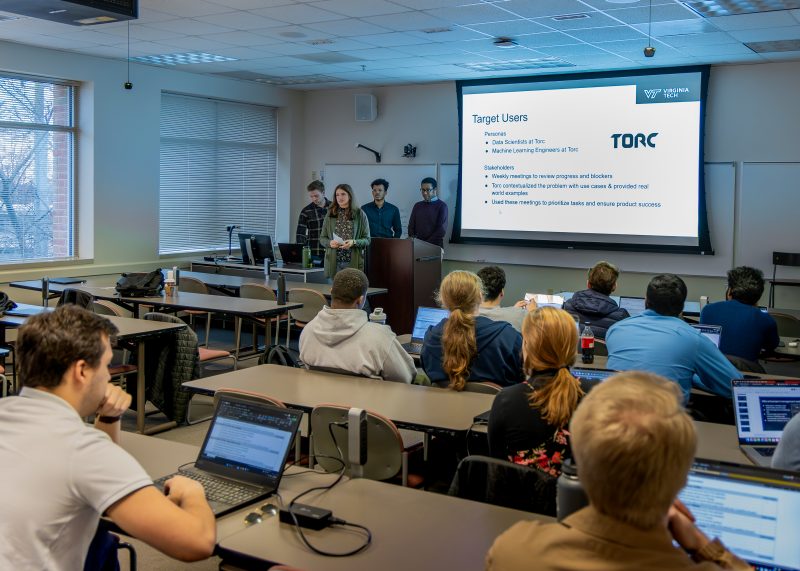 group of people presenting to a crowd