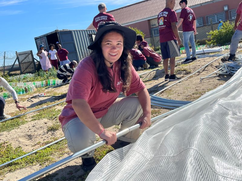 Clara Betts helps assemble a greenhouse an elementary school in Cape Town, South Africa.