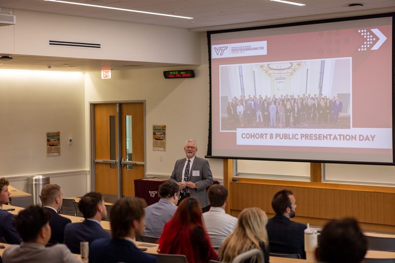 Cliff Ragsdale, academic director of the Center for Business Analytics, speaks to attendees at Public Presentation Day.