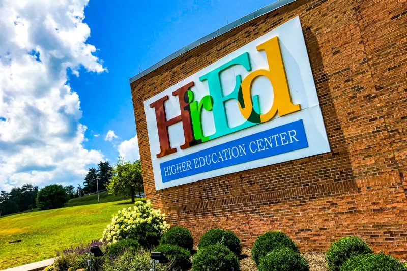 A colorful logo for the Higher Education Center.