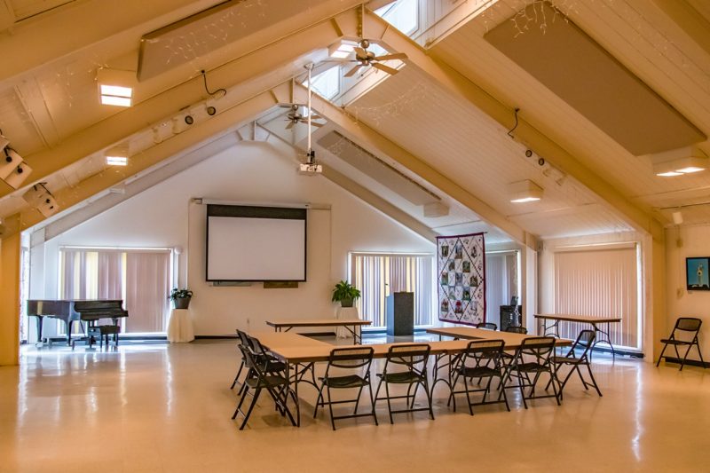 A large multipurpose room with cathedral ceilings.