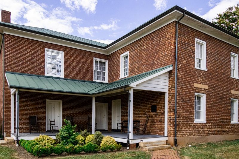 A old L-shaped brick house