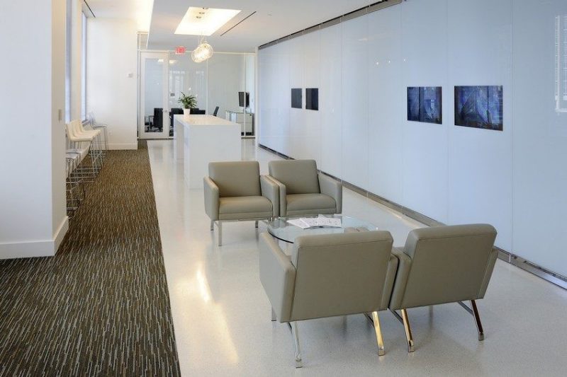 A modern lobby with white walls and floors.