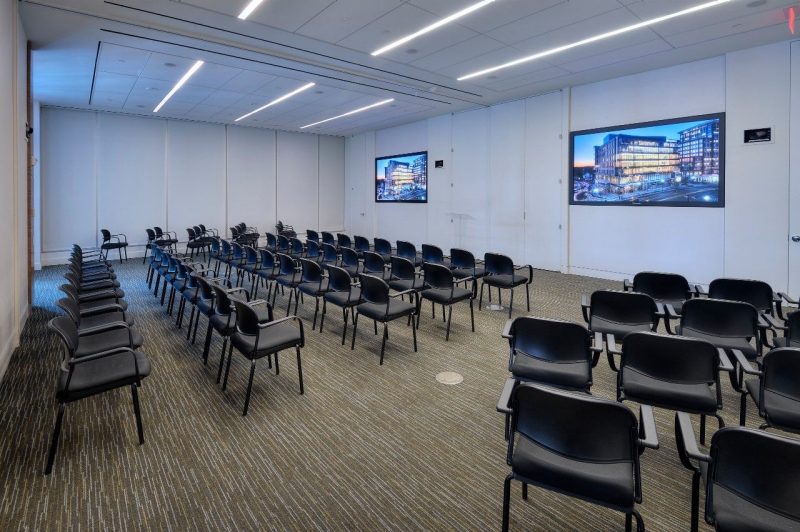 Chairs set up for an audience in a large room.