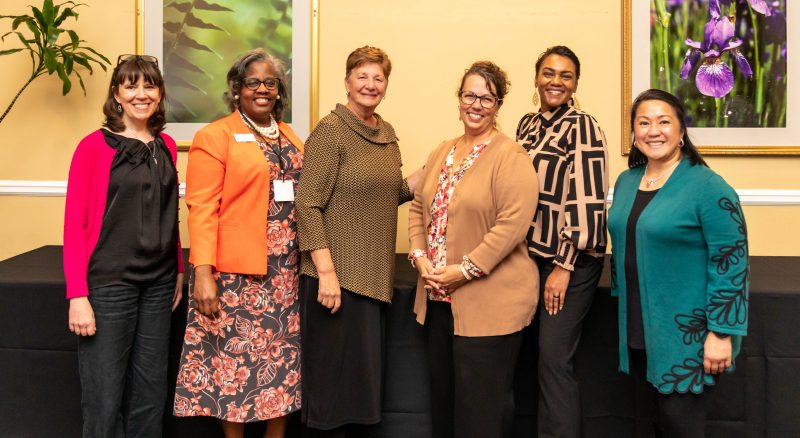 six members of the WIV advisory committee pose during the 2024 summit in Oct. 2024.