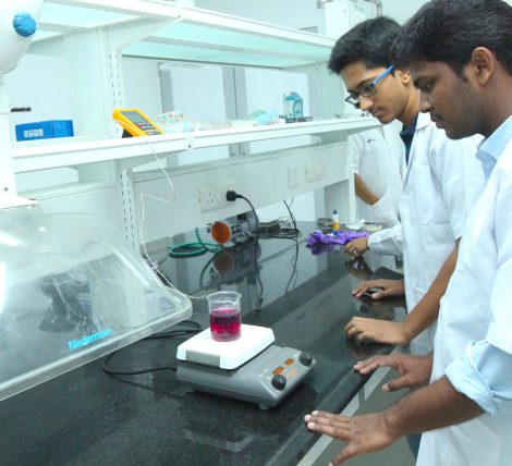 Two researchers at a bench