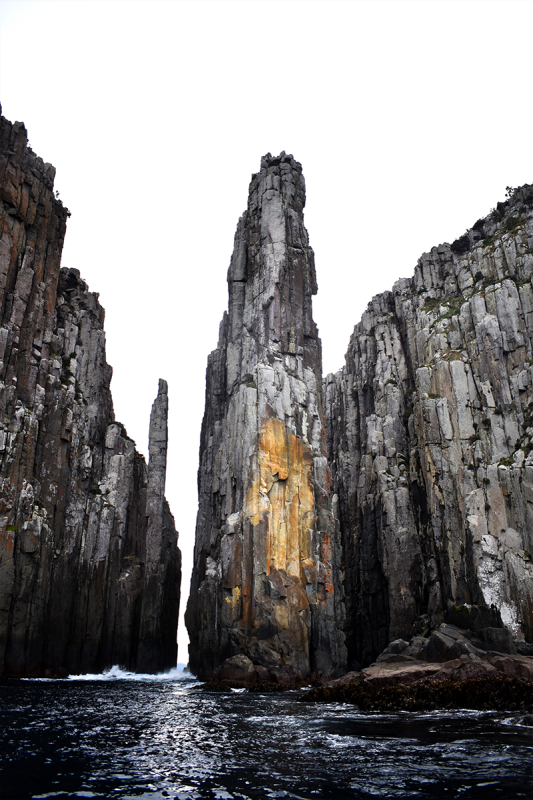 Rock formations off a steep rocky coastline